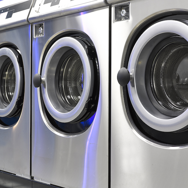 Industrial washing machines in a public laundromat